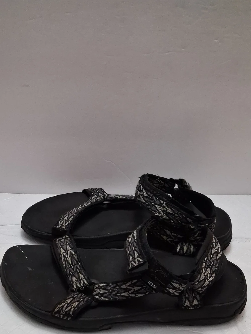 Teva Size 10 men's sandal in black, gray strap with velcro adjustable strap.